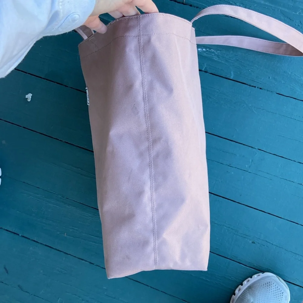 Herschel Supply Co. rose colored‎ canvas tote bag.